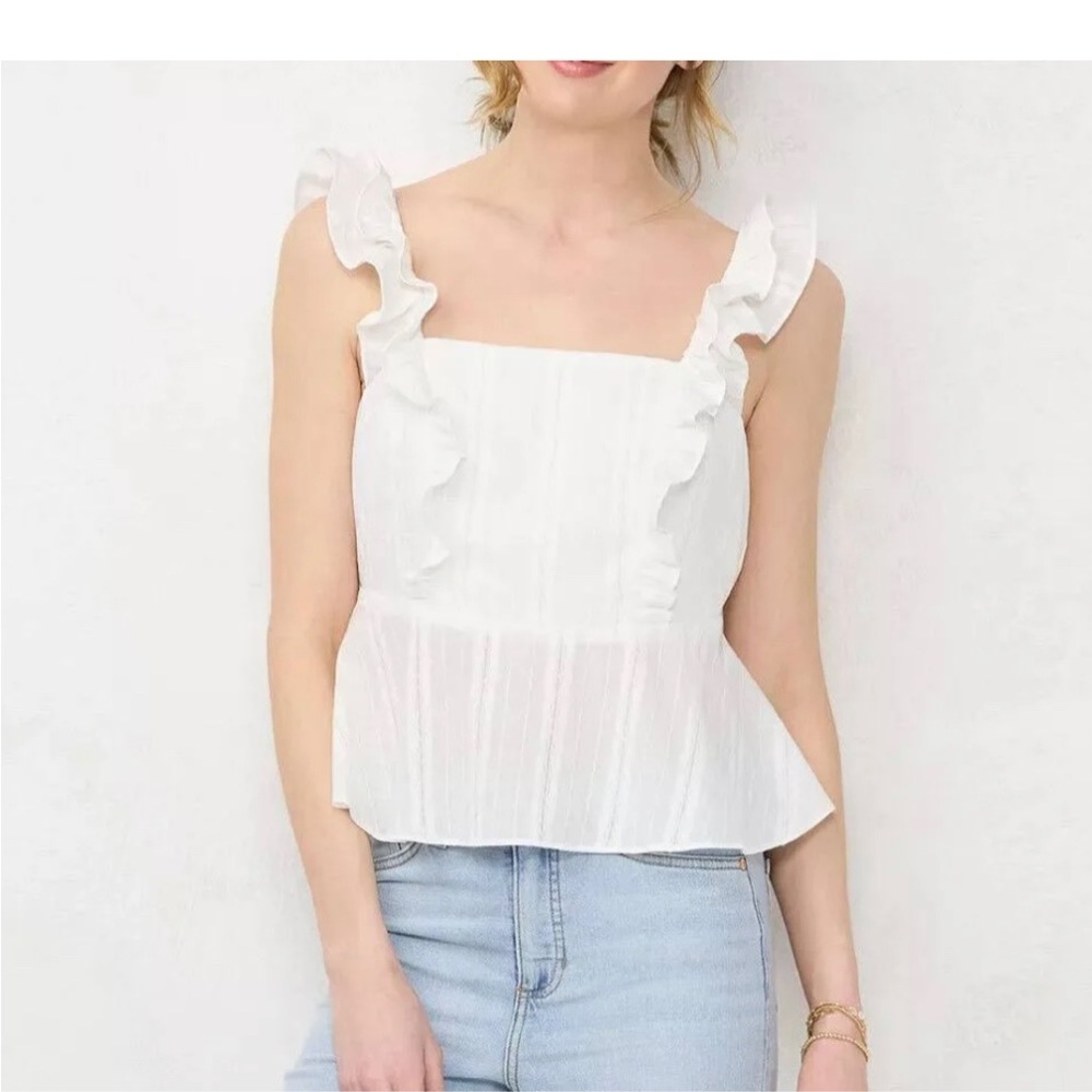 New white ruffle peplum tank from Lauren Conrad in size large.